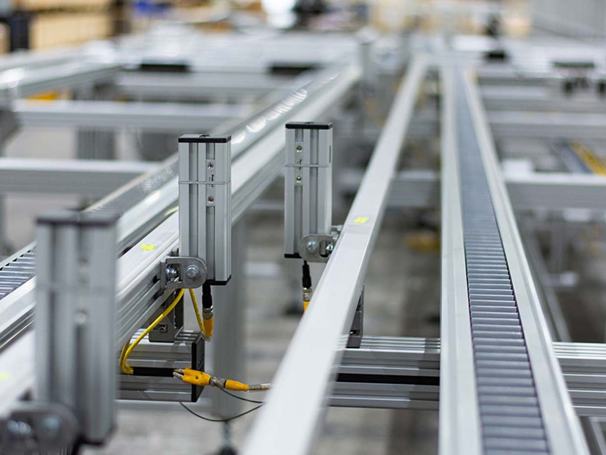 Tekno’s Core Product: The Modular Palletized Conveyor System